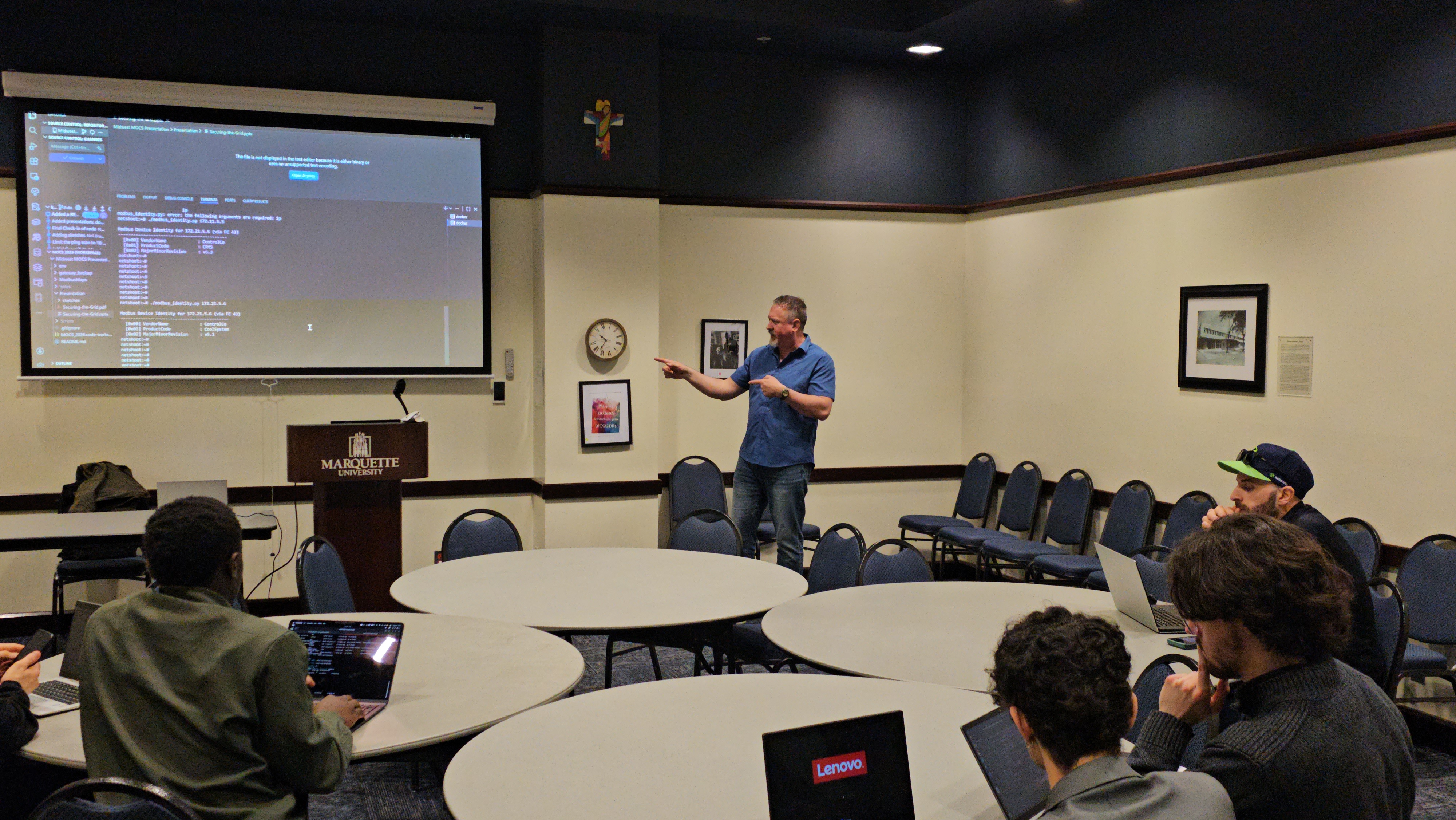 Hands-on lab with instructor at the screen and students at laptops